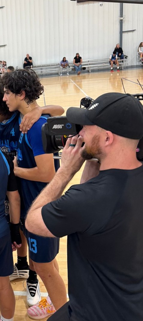 Legacy Line Media crew member filming courtside with an ARRI camera